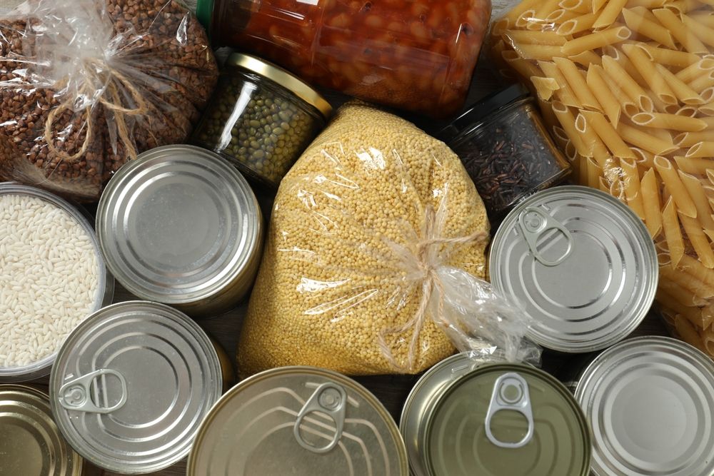 Food,Donations,On,Wooden,Background