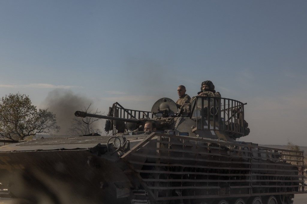 Ukrainian servicemen ride a tank on a road in the Donetsk region, on October 12, 2024, amid the Russian invasion on Ukraine. (Photo by Roman PILIPEY / AFP)