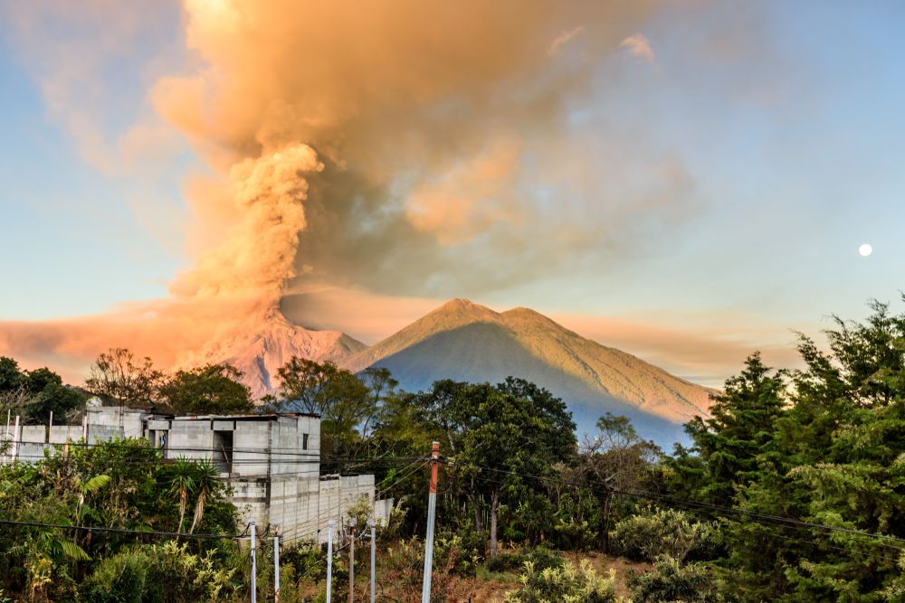 Fuego,Volcano,Erupting,At,Dawn,Next,To,Acatenango,Volcano,With