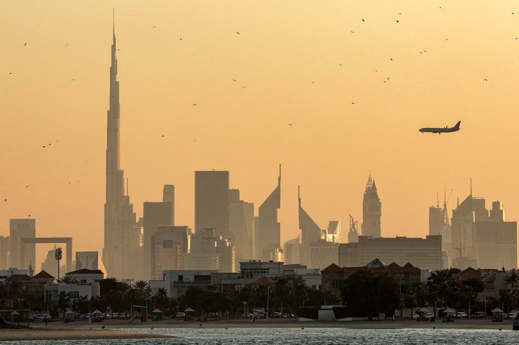 A Boeing aircraft operated by Russian flag carrier Aeroflot flies near the landmark Burj Khalifa skyscraper, the world’s tallest building, above the Dubai skyline on February 13, 2024. (Photo by Giuseppe CACACE / AFP) Boeing