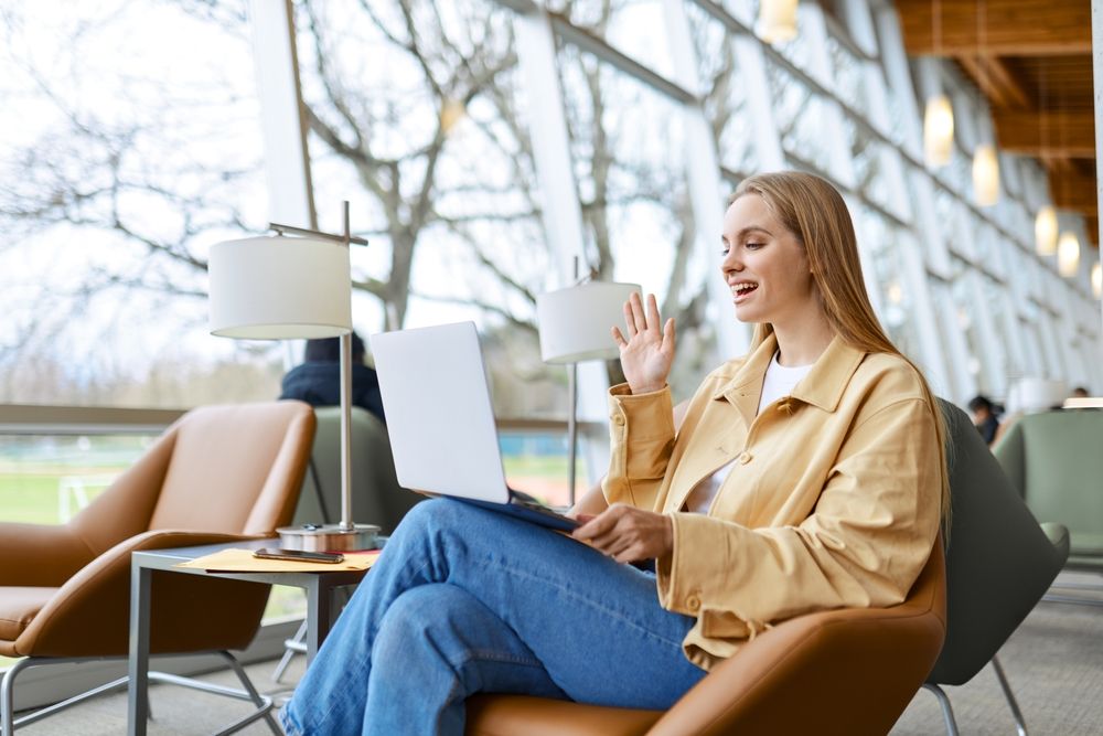 Happy,Young,Woman,,Smiling,Girl,Student,Waving,Hand,Looking,At