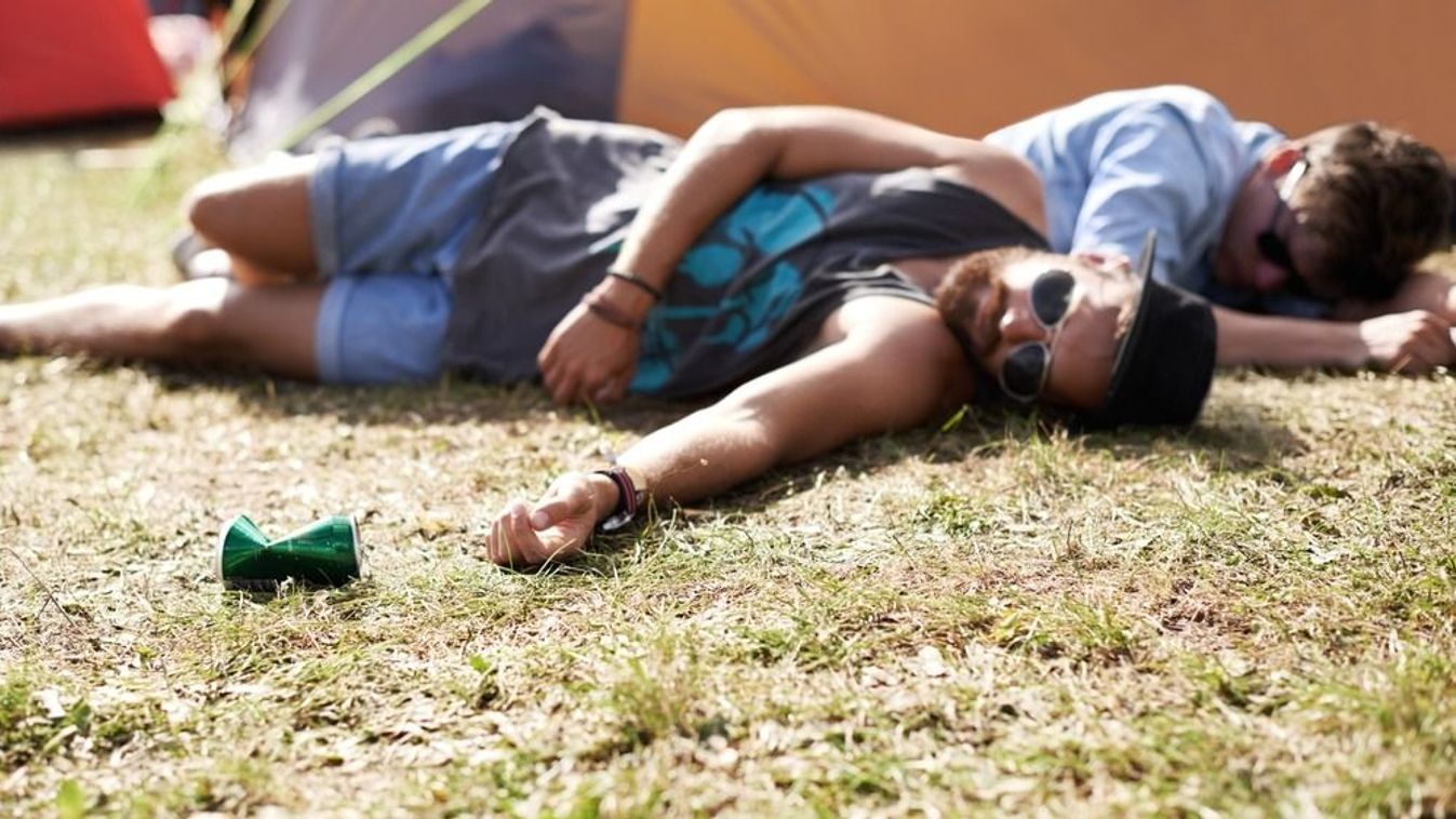 Drunk,,Sleeping,And,Men,On,Camping,Ground,At,A,Music