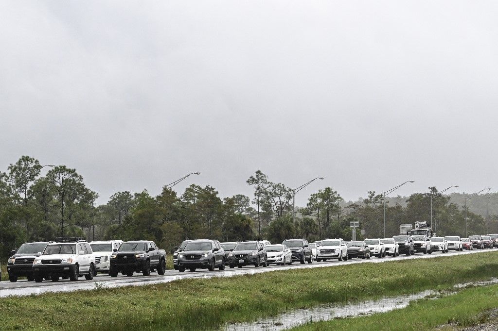 On heels of Helene, storm Milton expected to strengthen into major hurricane and slam Florida
Cars drive east out of Naples, Florida, towards Miami on October 8, 2024, as Hurricane Milton approaches. Milton regained power on October 8 to become a Category 5 storm with maximum sustained winds of 165 mph (270 kph) as it barrels towards west-central coast of Florida and is forecast to make landfall late October 9, according to the National Hurricane Center. (Photo by Chandan Khanna / AFP) Milton hurrikán