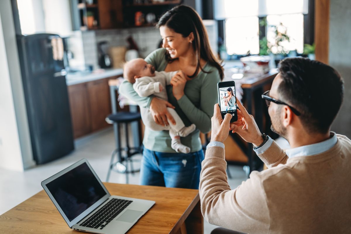 Proud,Father,Take,Picture,Of,His,Wife,With,Infant,Baby