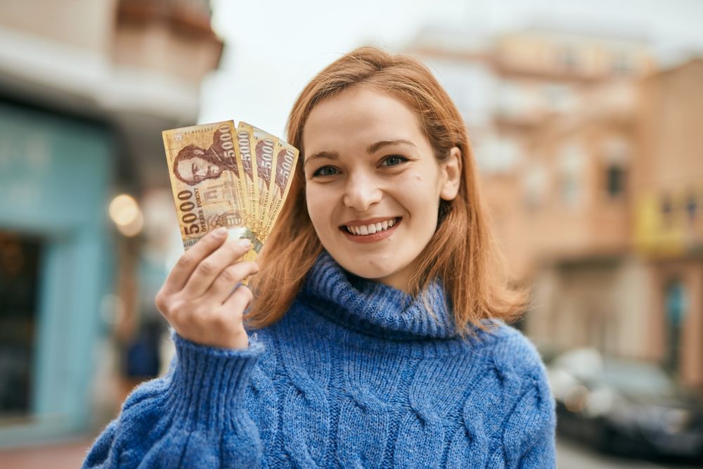 Young,Caucasian,Girl,Smiling,Happy,Holding,Hungarian,Forint,Banknotes,At