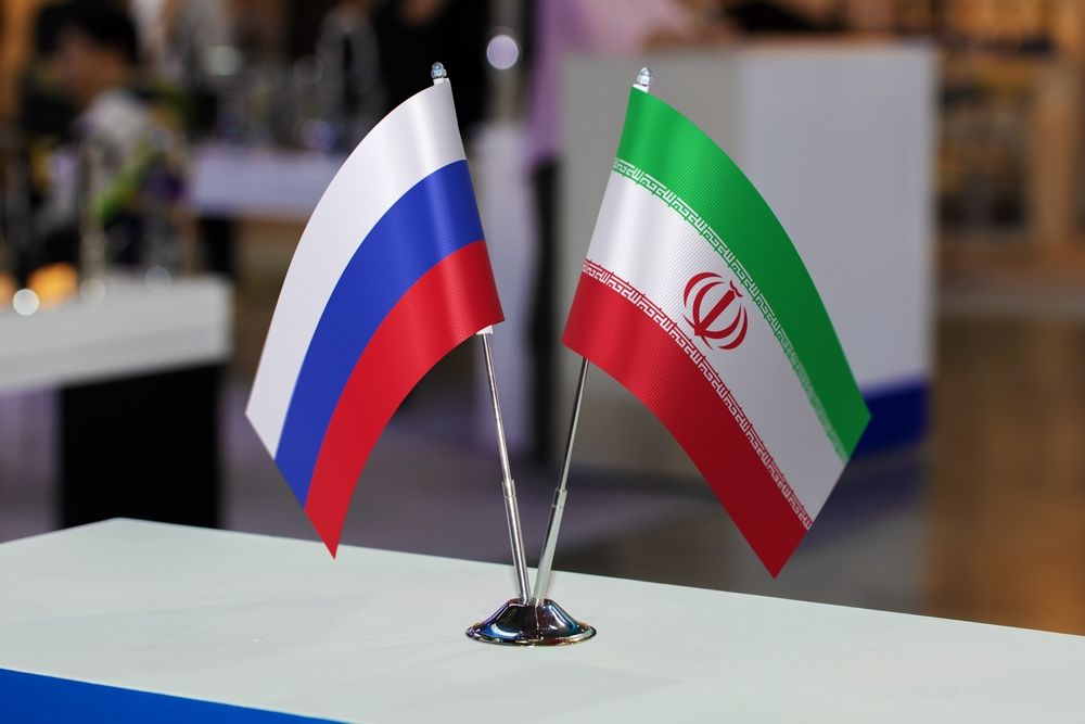 Two,Small,Table,Flags,Of,Russia,And,Iran,Together,At stratégiai együttműködés