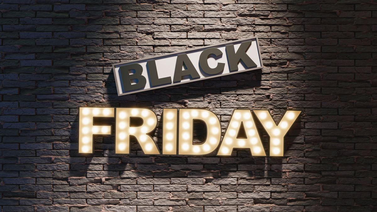 Black Friday signboard hanging on gray wall