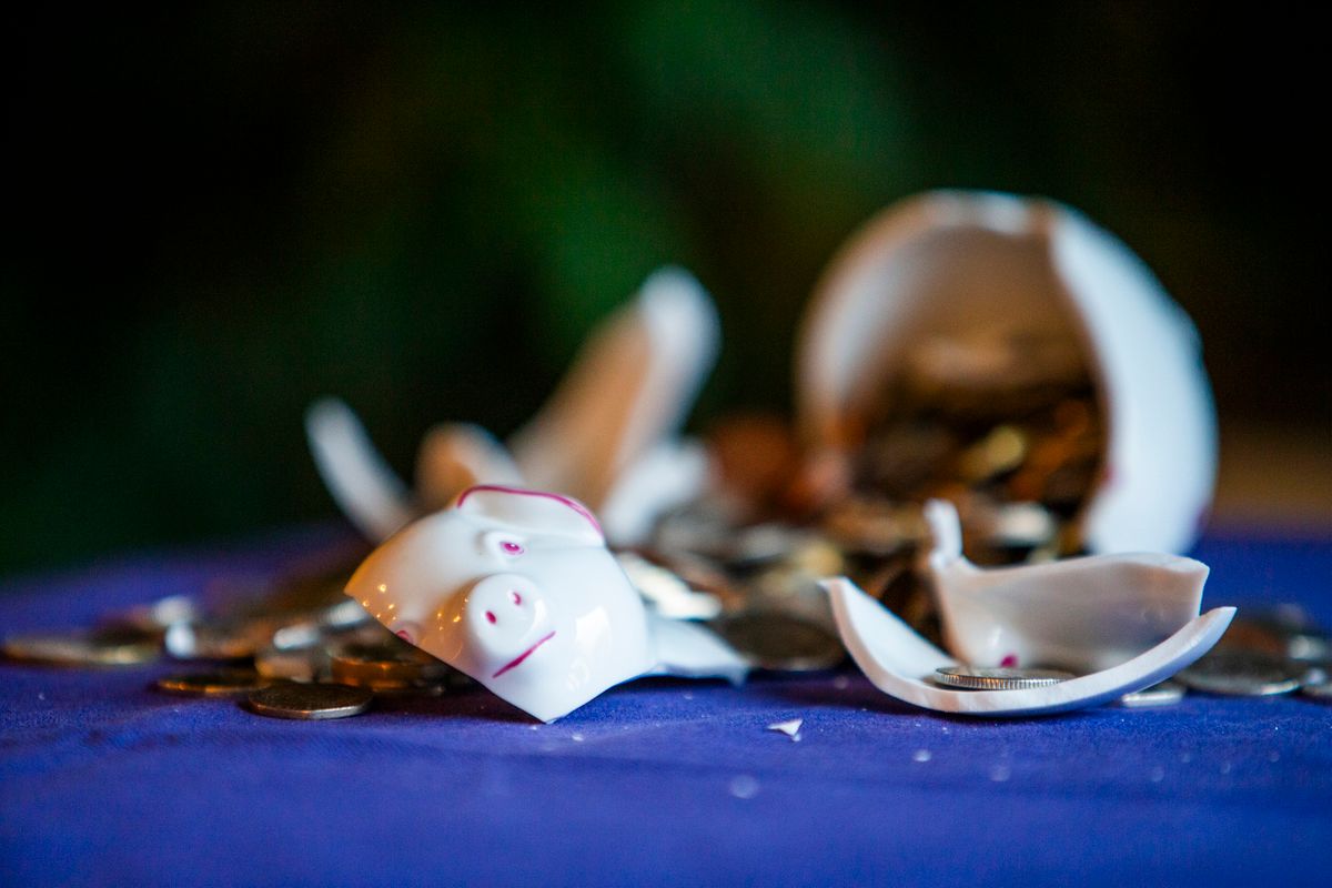 A shattered piggybank with focus on the pig's eye