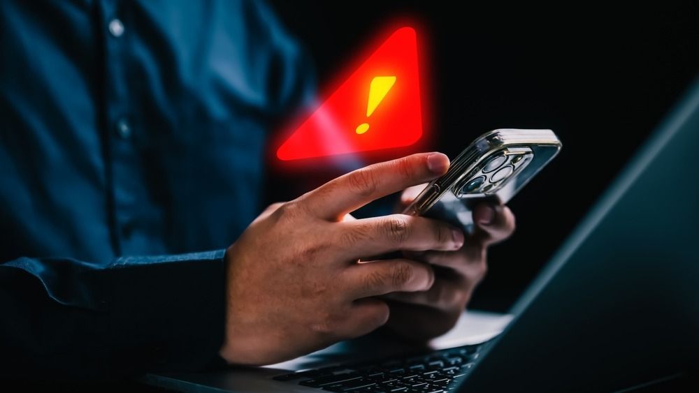 People,With,Warning,Notification,And,Spam,Message,Icon,On,Mobile