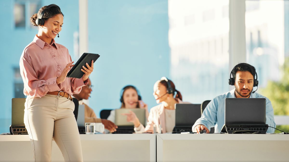 Happy,Woman,,Call,Center,Or,Manager,With,Tablet,In,Customer
