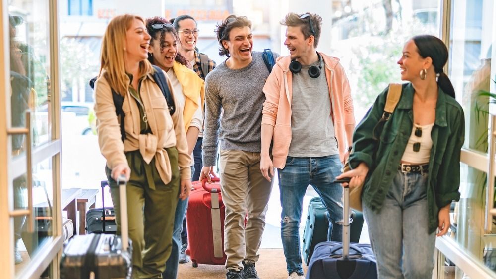 Group,Of,University,College,Tourist,Walking,Inside,The,Hotel,With