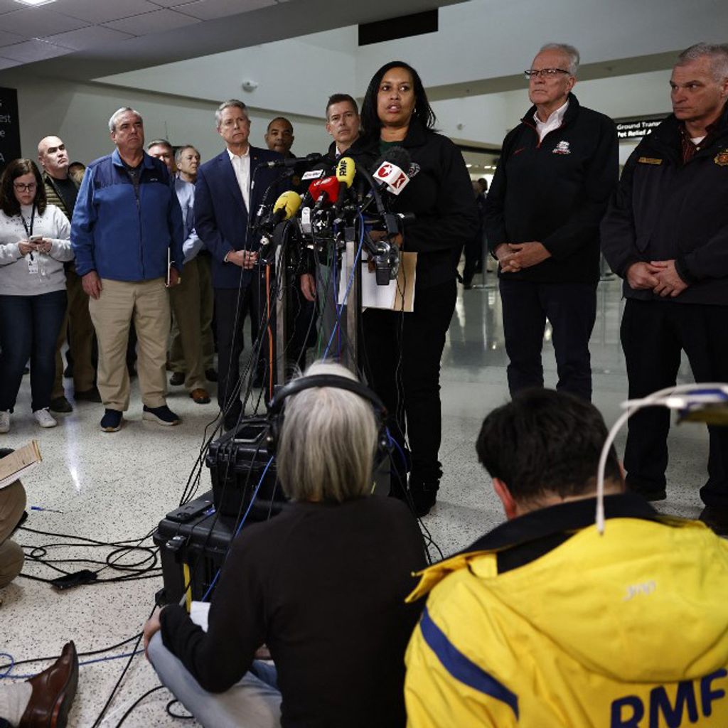 DC Mayor Muriel Bowser speaks at a media briefing at Reagan National Airport after a plane crashed into the Potomac River outside Washington, DC, January 30, 2025. A regional jet from Kansas crashed into Washington's Potomac River after colliding mid-air with a military helicopter near Reagan National Airport, officials said January 29, prompting a major emergency response and grounding all flights. (Photo by Ting Shen / AFP)