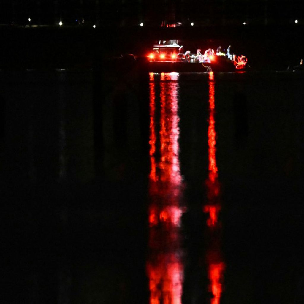 A rescue boat searches the waters of the Potomac River after a plane on approach to Reagan National Airport crashed into the river outside Washington, DC, January 30, 2025. A regional jet from Kansas crashed into Washington's Potomac River after colliding mid-air with a military helicopter near Reagan National Airport, officials said January 29, prompting a major emergency response and grounding all flights. (Photo by ANDREW CABALLERO-REYNOLDS / AFP)