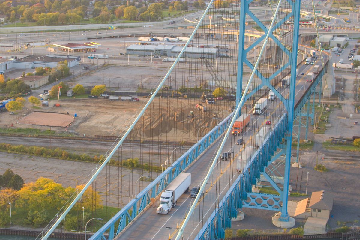 Aerial:,Flying,Above,Semi,Trucks,Transporting,Goods,On,Multiple,Lane
