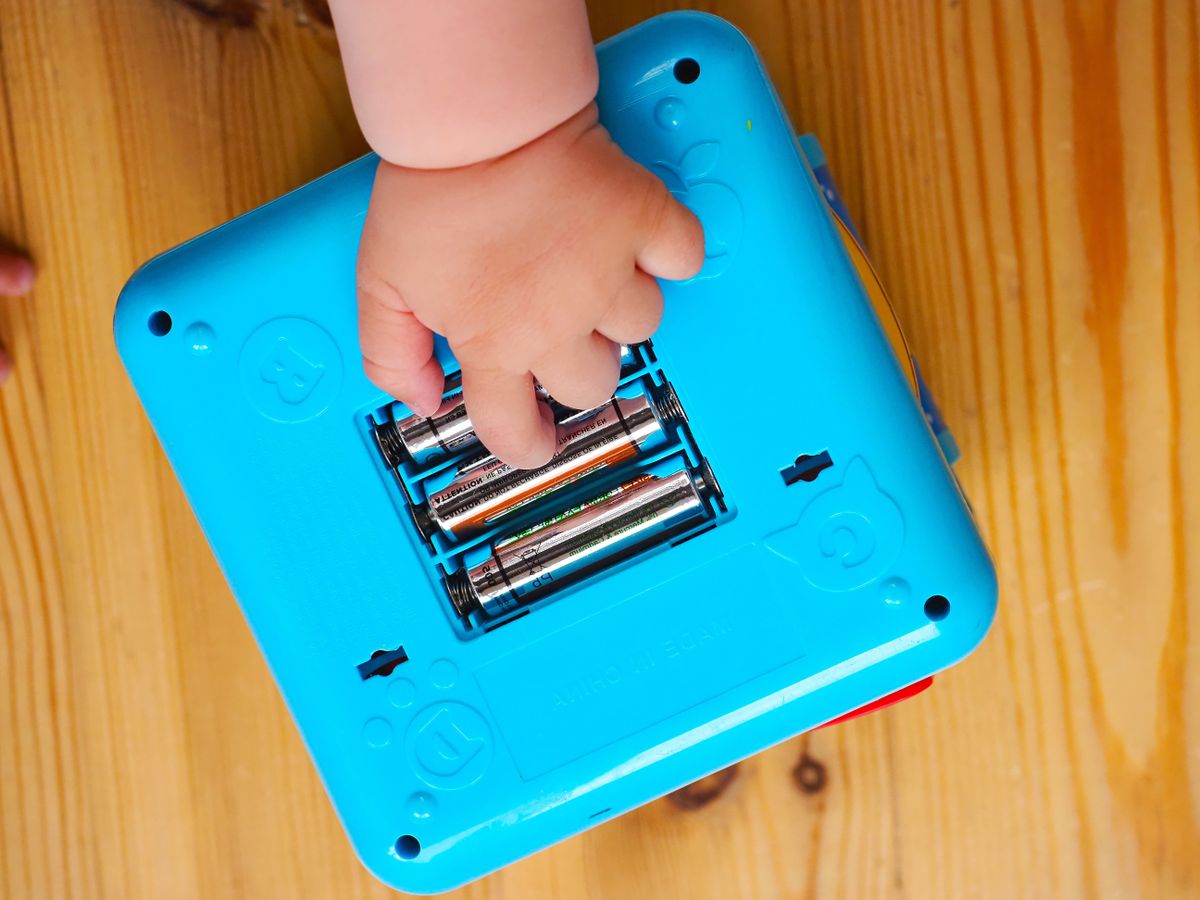 Belarus,minsk,2022.,The,Baby,Takes,Out,The,Batteries,From,The,Toy