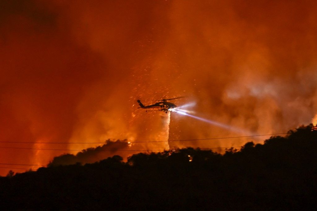 Aerial firefighting efforts intensify over the Palisades wildfire in Los Angeles