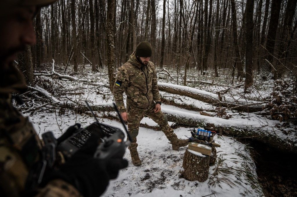 Ukrainian soldiers operate an FPV attack drone in the Kharkiv region