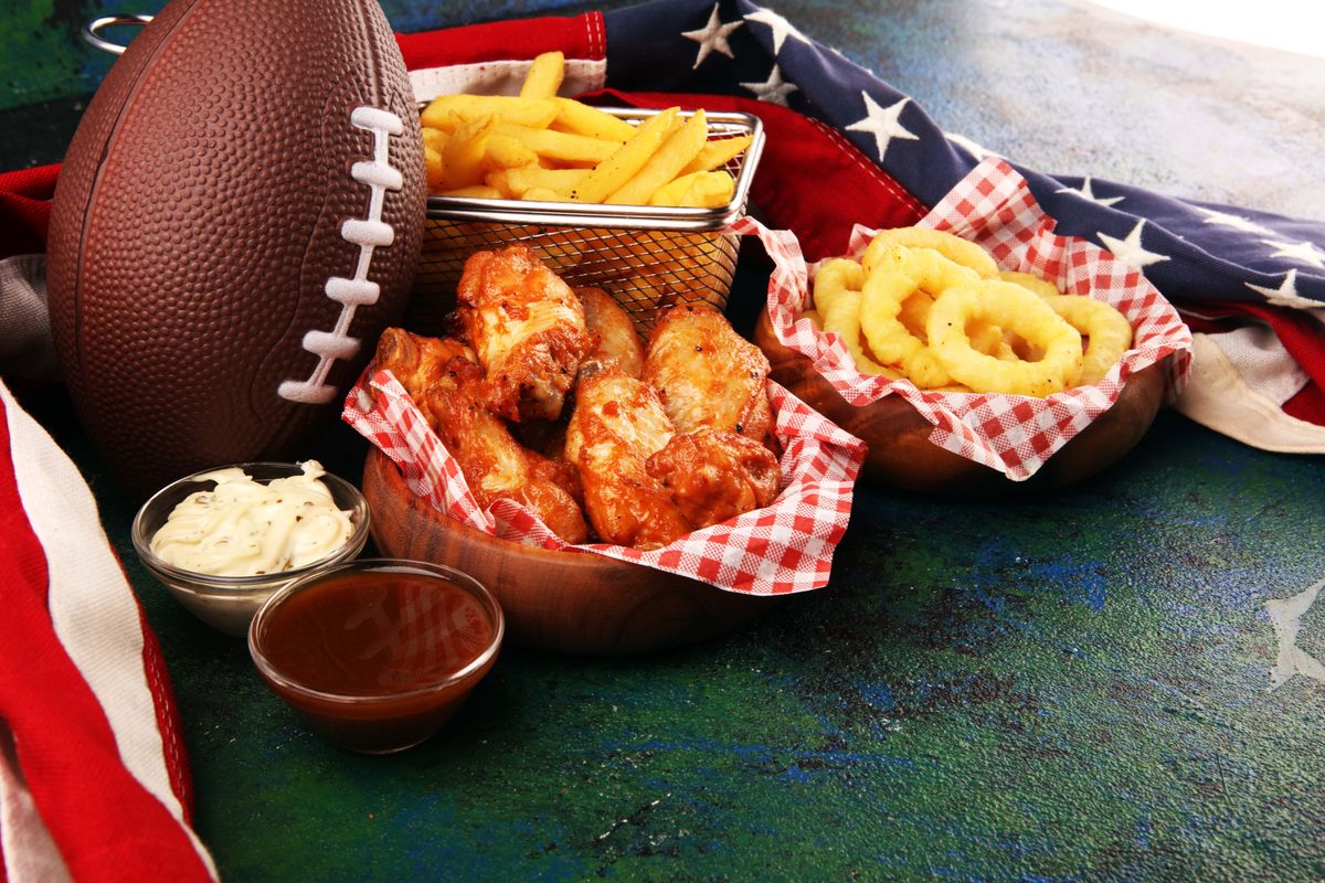 Chicken,Wings,,Fries,And,Onion,Rings,For,Football,On,A