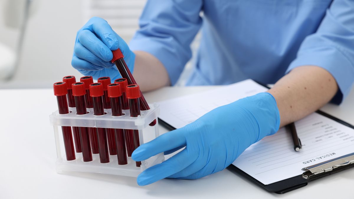 Laboratory,Testing.,Doctor,With,Blood,Samples,In,Tubes,At,White