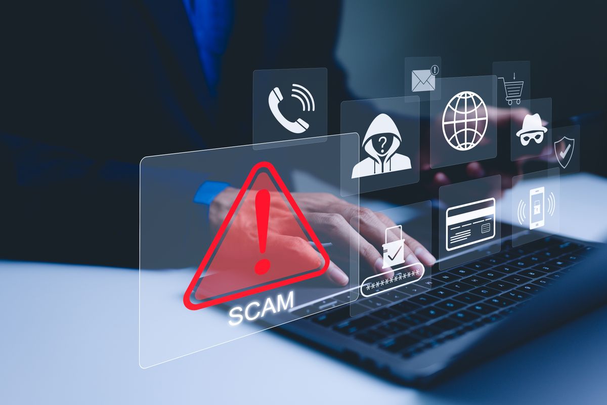Scam,Alert,Warning,With,Cybersecurity,Icons.,A,Person,Using,Laptop, online átverés csalók csalás scam
