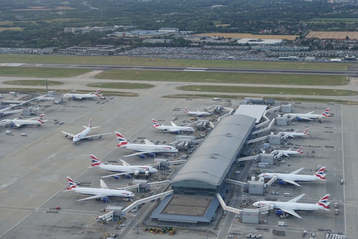 British,Airways,Airplanes,Sit,At,Terminal,Gates,On,The,Tarmac