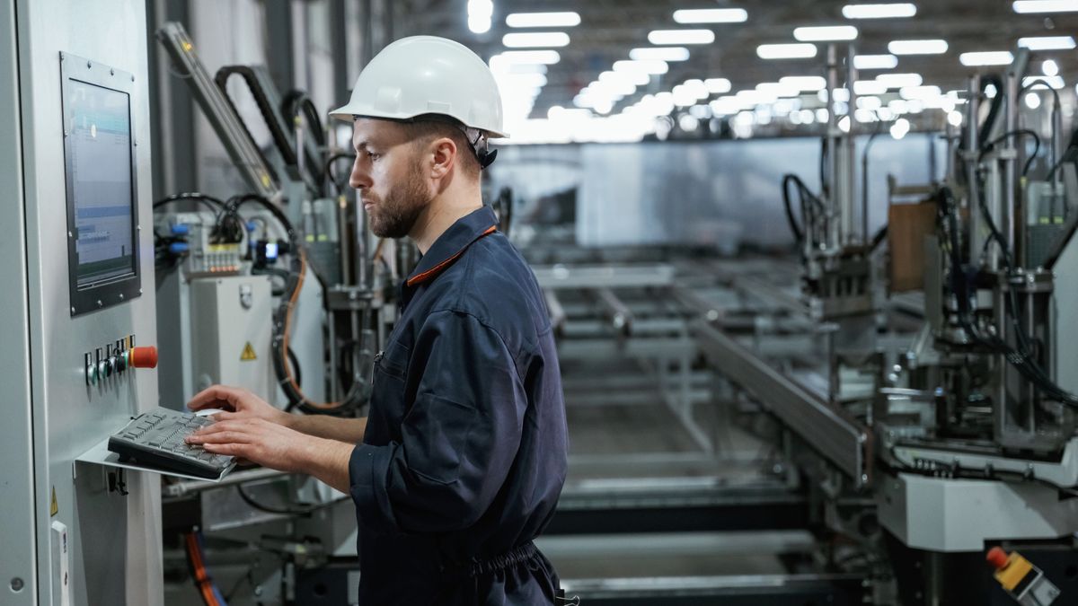 Busy,Employee.,Factory,Worker,Is,Indoors,With,Hard,Hat. zalaegerszeg europtec