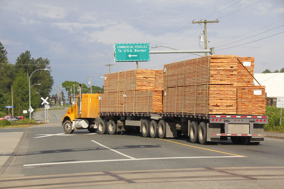 A,Double,Flatbed,Truck,Navigates,To,The,Us,Border,Delivering Doland Trump