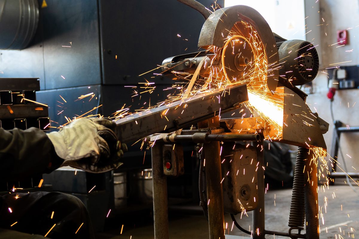 The,Man,Is,Cutting,A,Metal,Box,Using,Cutting,Machine