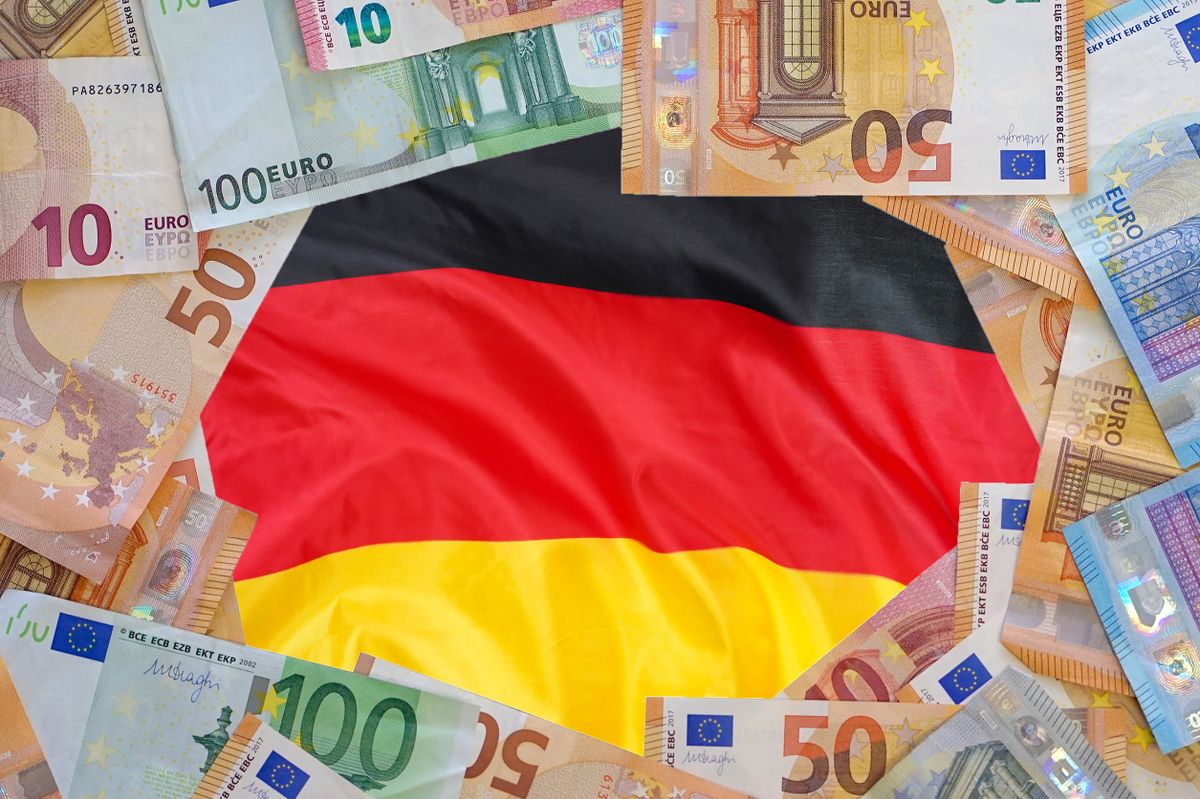 Macup,Of,Euro,Banknotes,On,The,Flag,Of,Germany,Background.