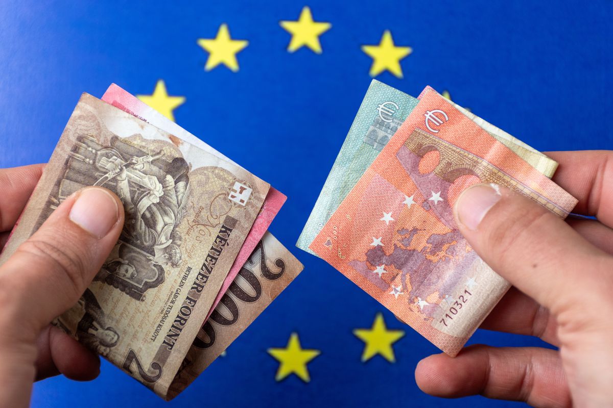 forint Euro,And,Forint,Banknotes,In,Hand