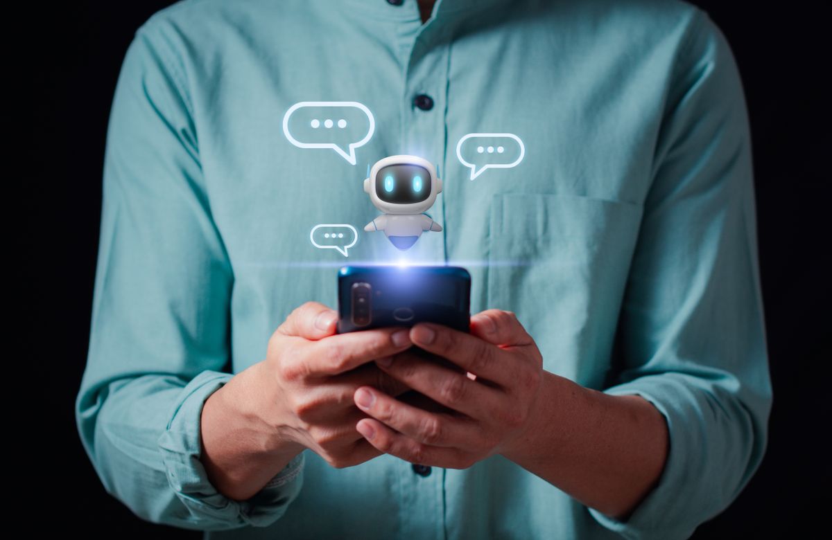 Person,Using,A,Smartphone,To,Interact,With,A,Friendly,Ai