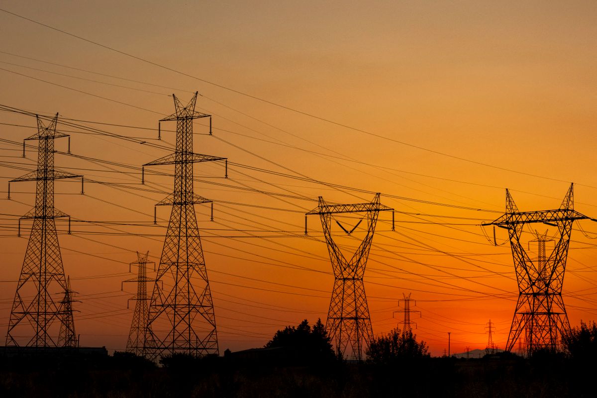 High Voltage Pylons During Sunset Time