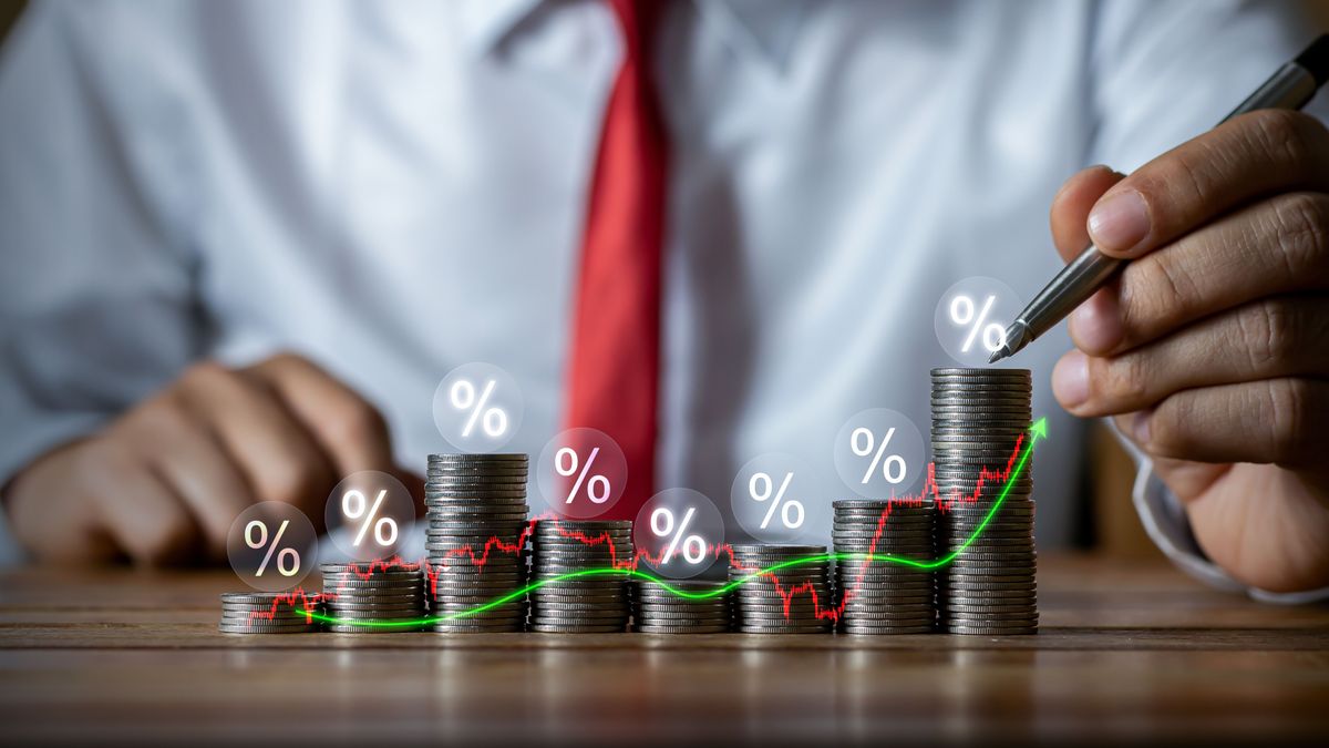 forint Businessman,Putting,Down,Money,,Pointing,With,Pen,And,Showing,Candlestick