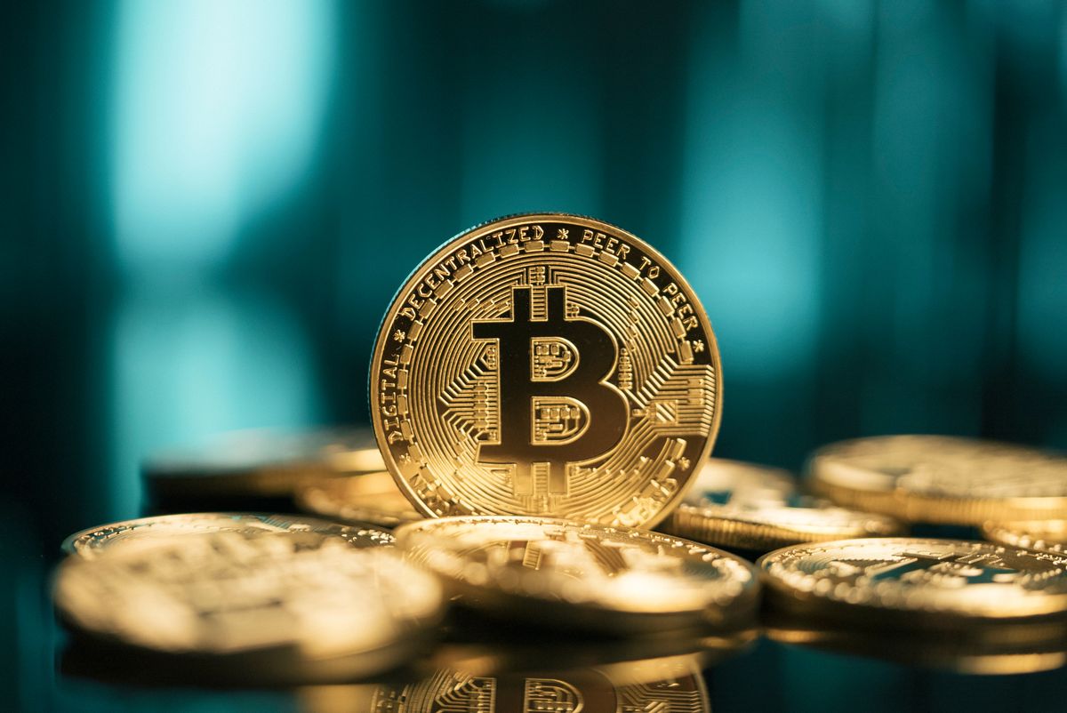 Bitcoin,Btc,Virtual,Cryptocurrency,In,Front,Of,Abstract,Digital,Background