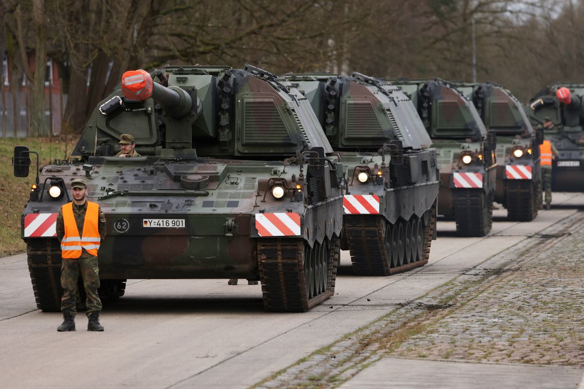 Bundeswehr soldiers prepare Pzh 2000 self-propelled howitzers for transport, in Munster.