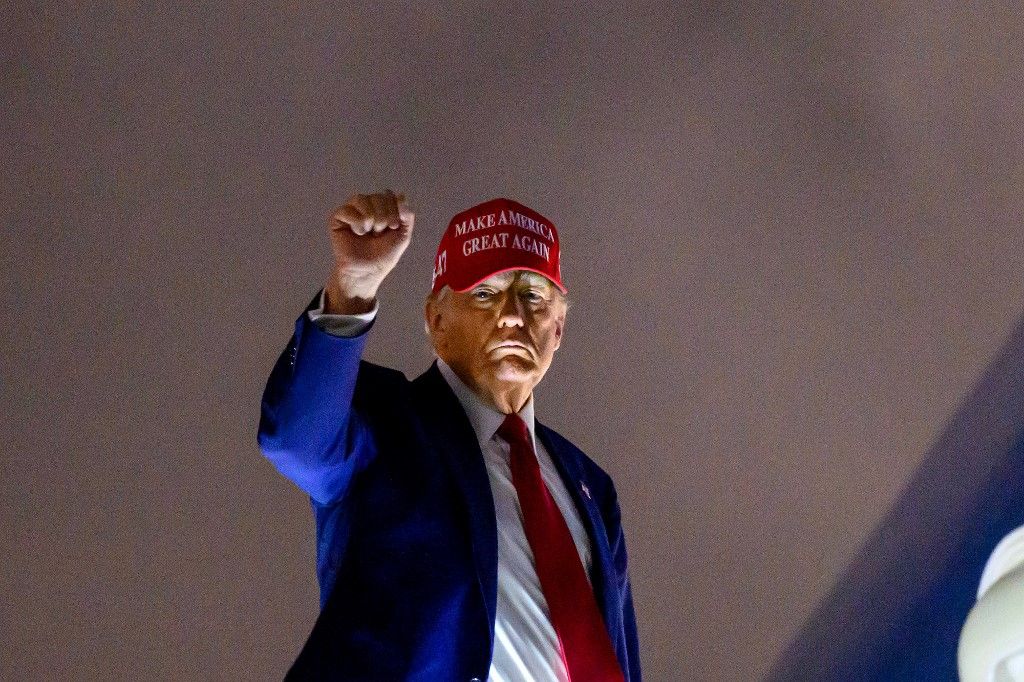 US President Donald Trump steps off Air Force One arrives at Miami International Airport