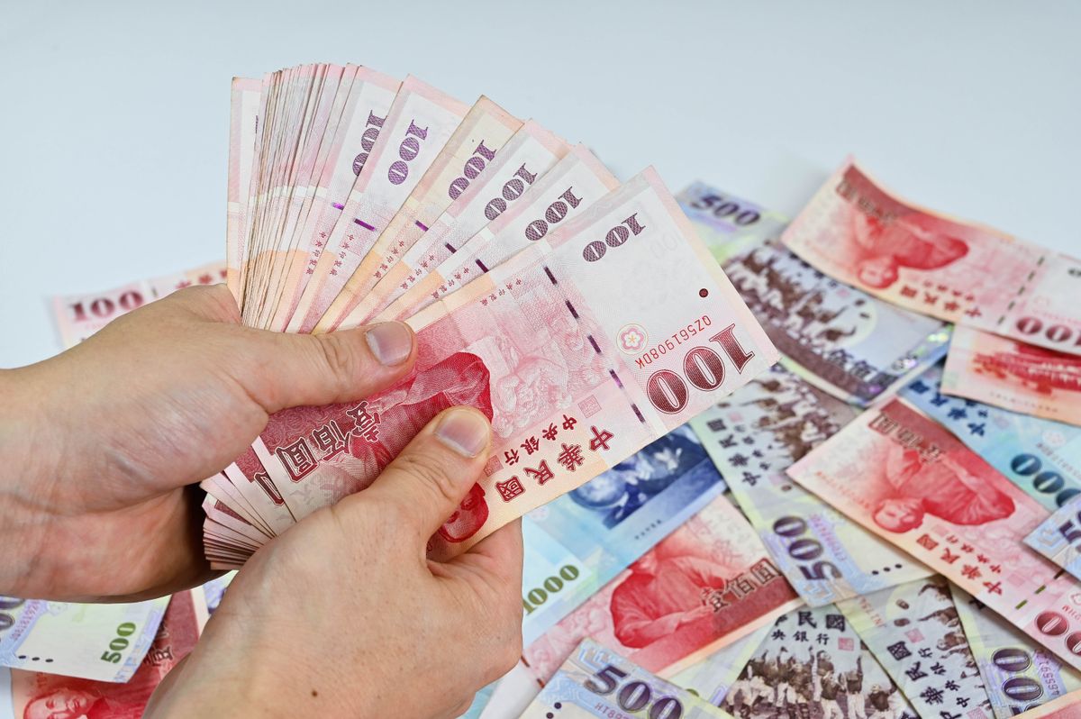 Hand,Holding,New,Taiwan,Dollar
