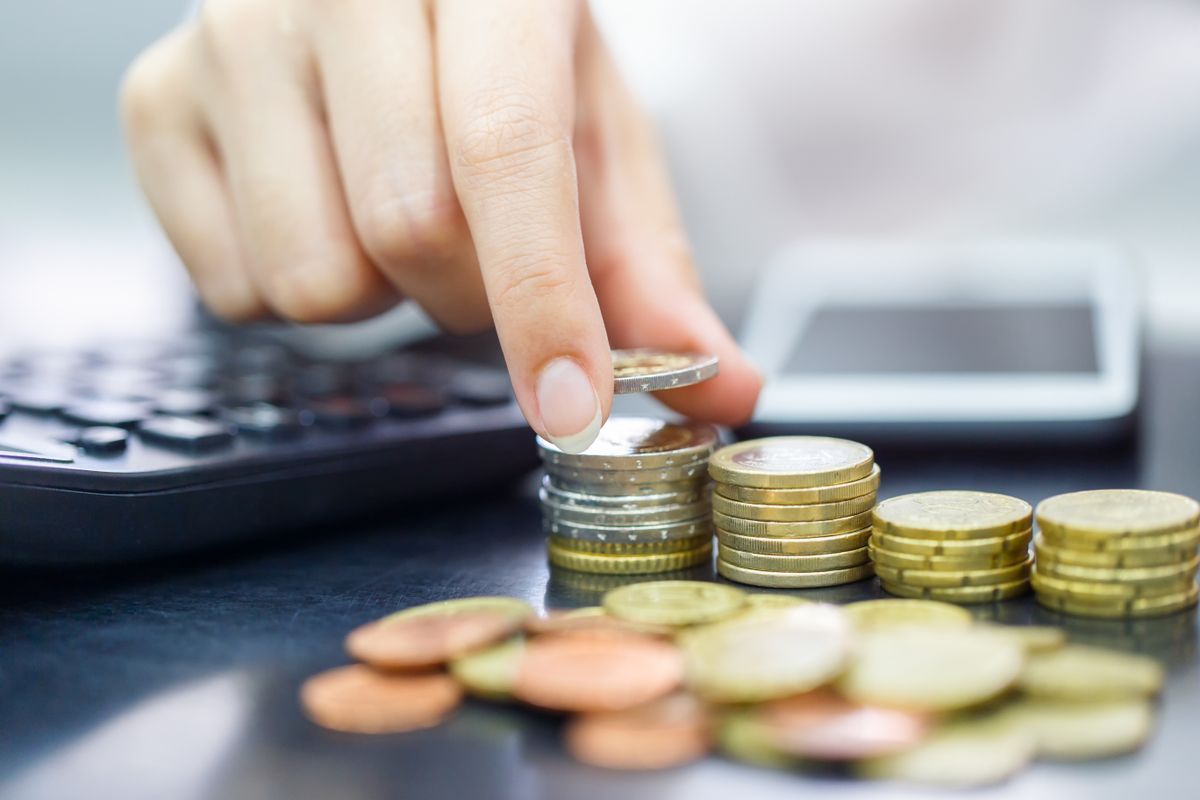Female,Hand,Stack,Euro,Coins,To,Shown,Concept,Of,Growing
