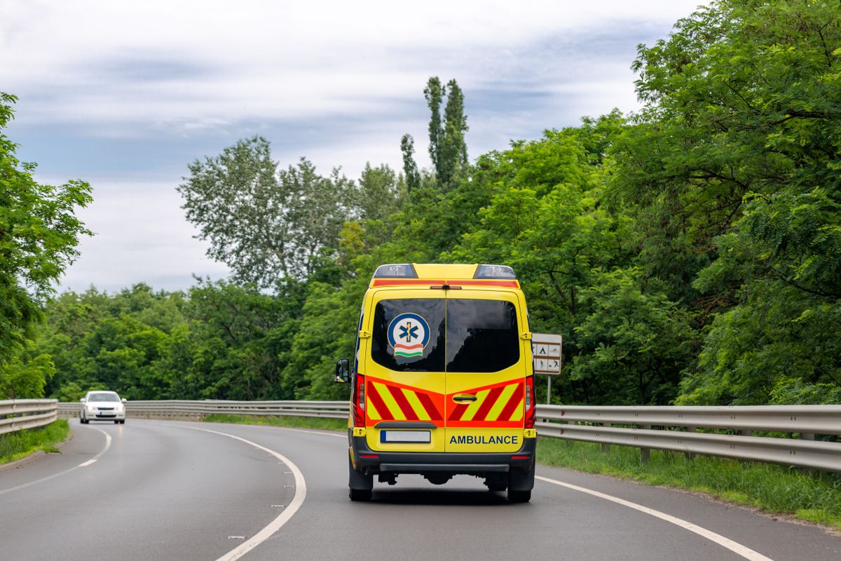 Ambulance,Van,On,The,Road.,Bright,Green,Trees,Along,Road