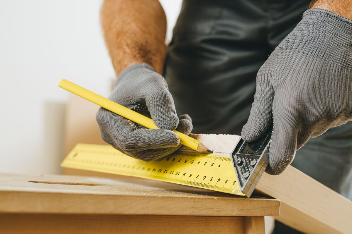 Demján Sándor Tőkeprogram Close,Up,Of,Carpenter,Measuring,Wooden,Board.,Professional,Woodworker,Using