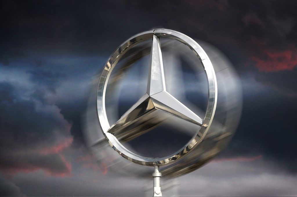 Mercedes-Benz's profits fall by more than half.