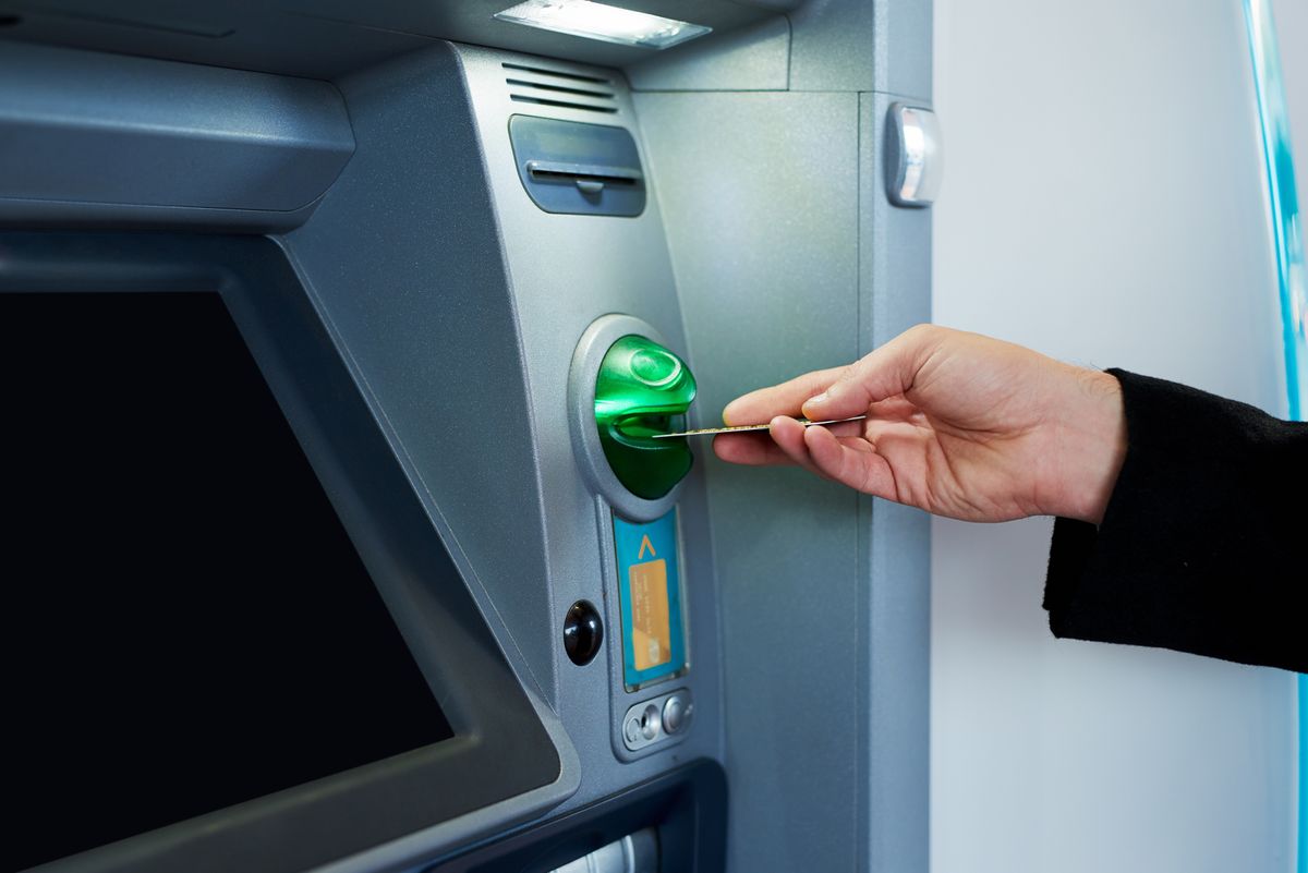 merkantil bank Business,,Person,And,Hand,With,Credit,Card,At,Atm,For