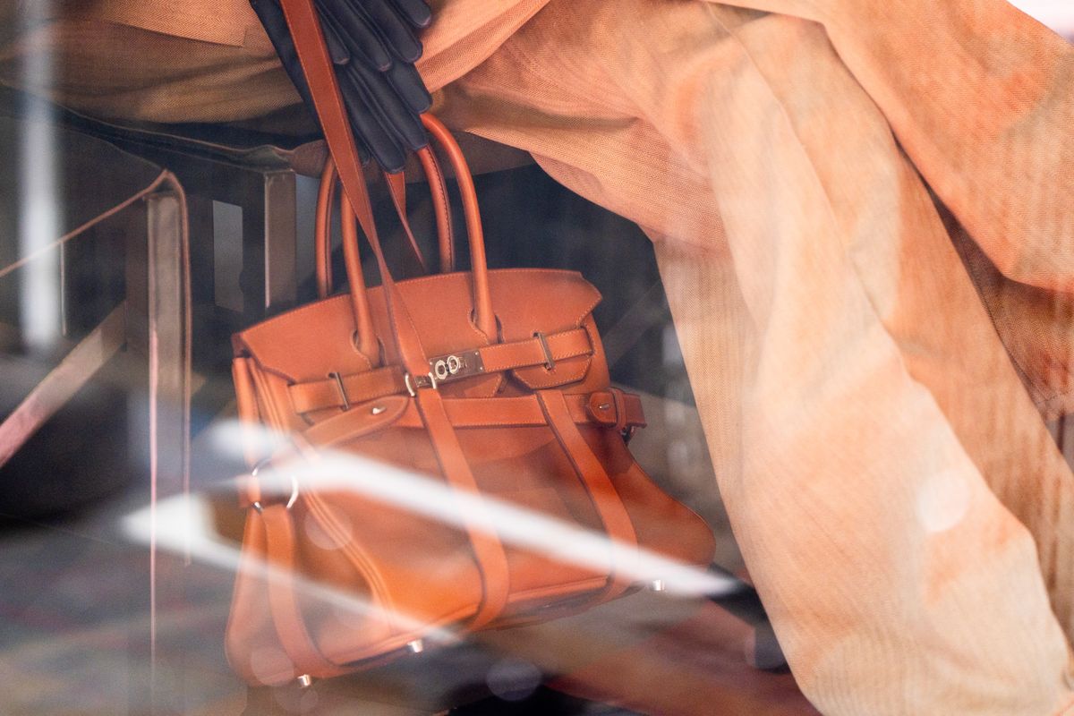 A Birkin handbag in the window of a Hermes luxury boutique in Paris.