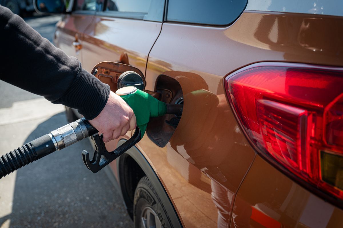 Man,Refills,Car,With,Gasoline,At,A,Fuel,Pump,,A