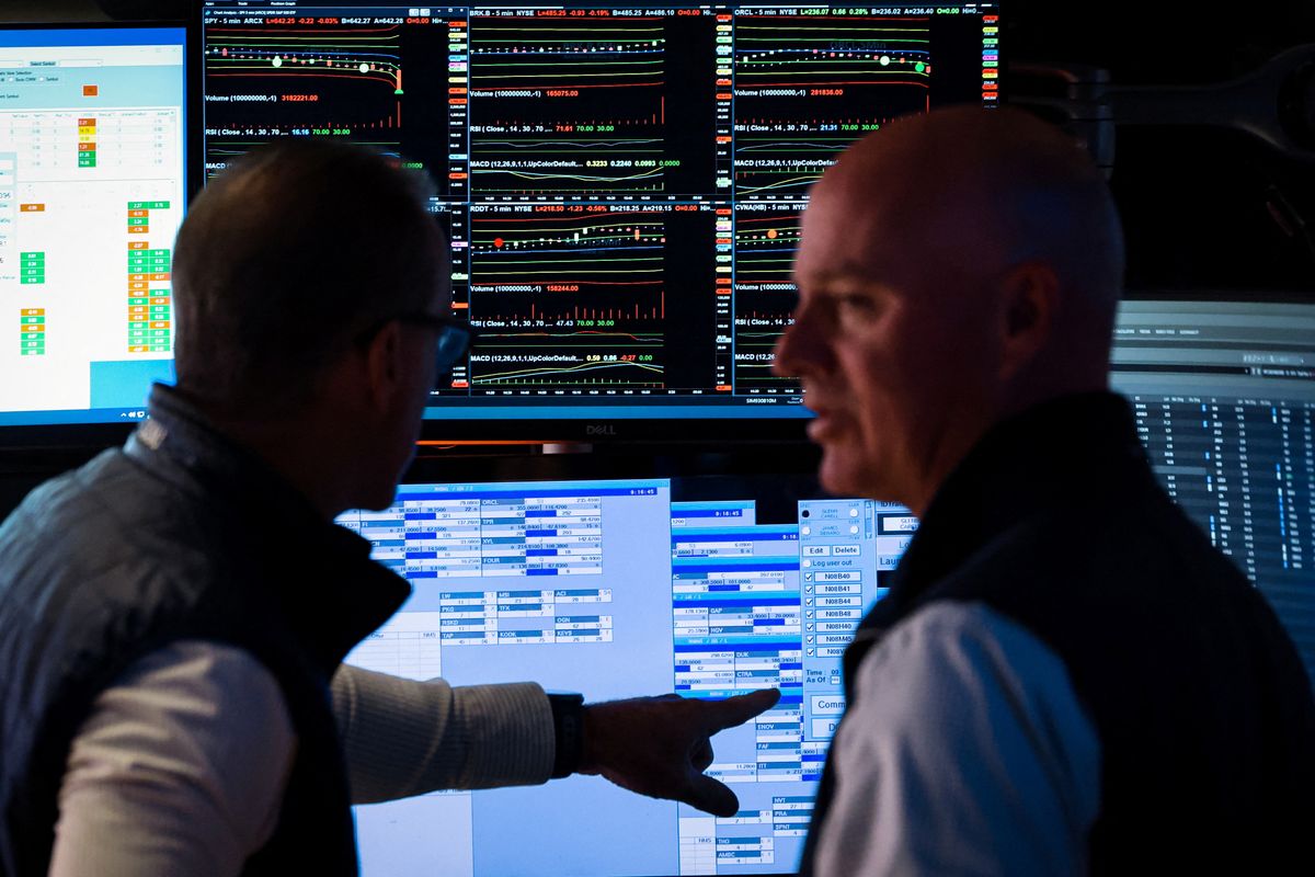 Traders work on the floor of the NYSE in New York