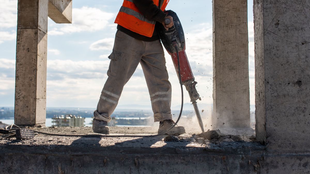 budapest Construction,Worker,Using,Jackhammer,To,Drill,Concrete,Floor.