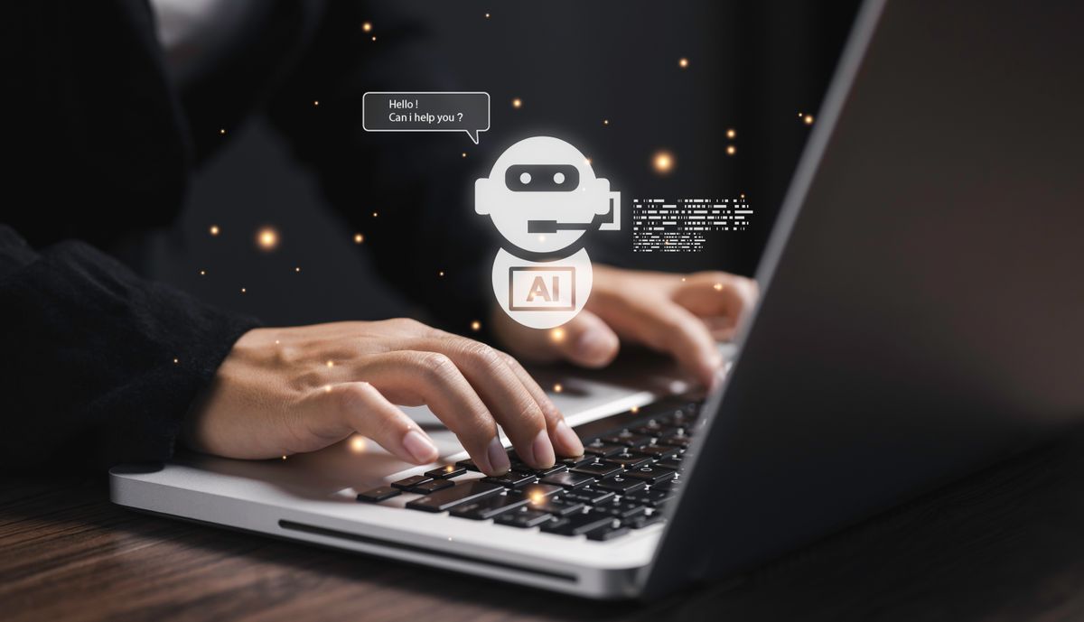 Hands,Typing,On,Laptop,With,Futuristic,Ai,Chatbot,Assistant,Hologram,
