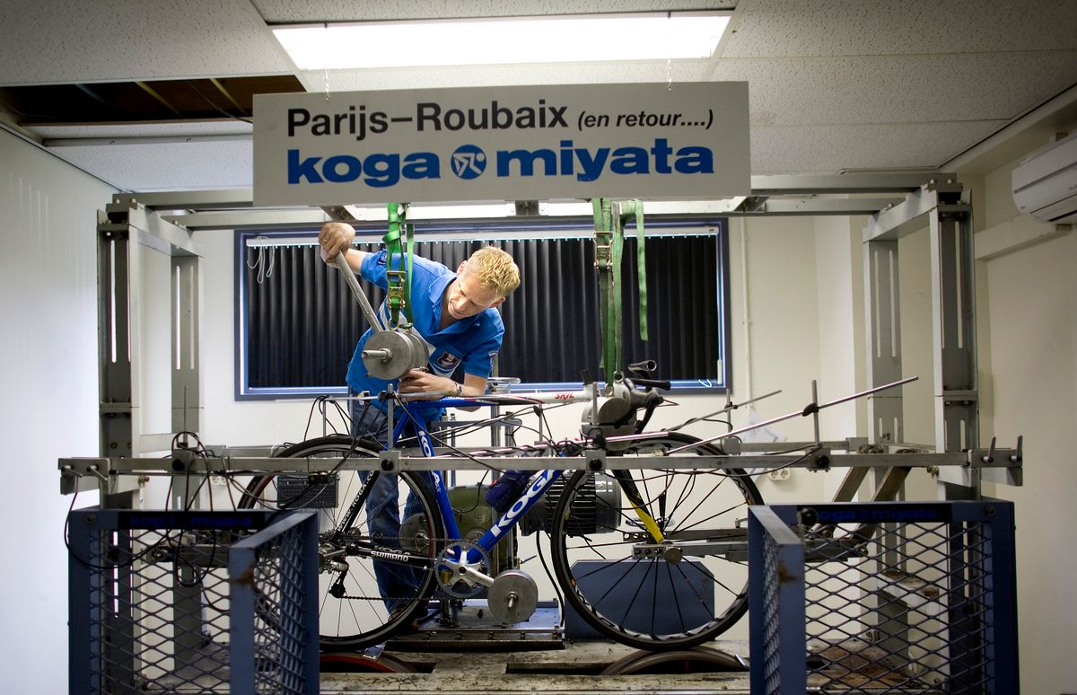 A technician examines a broken Koga Miyata bicycle at the company's factory in the Dutch northern town of Heerenveen