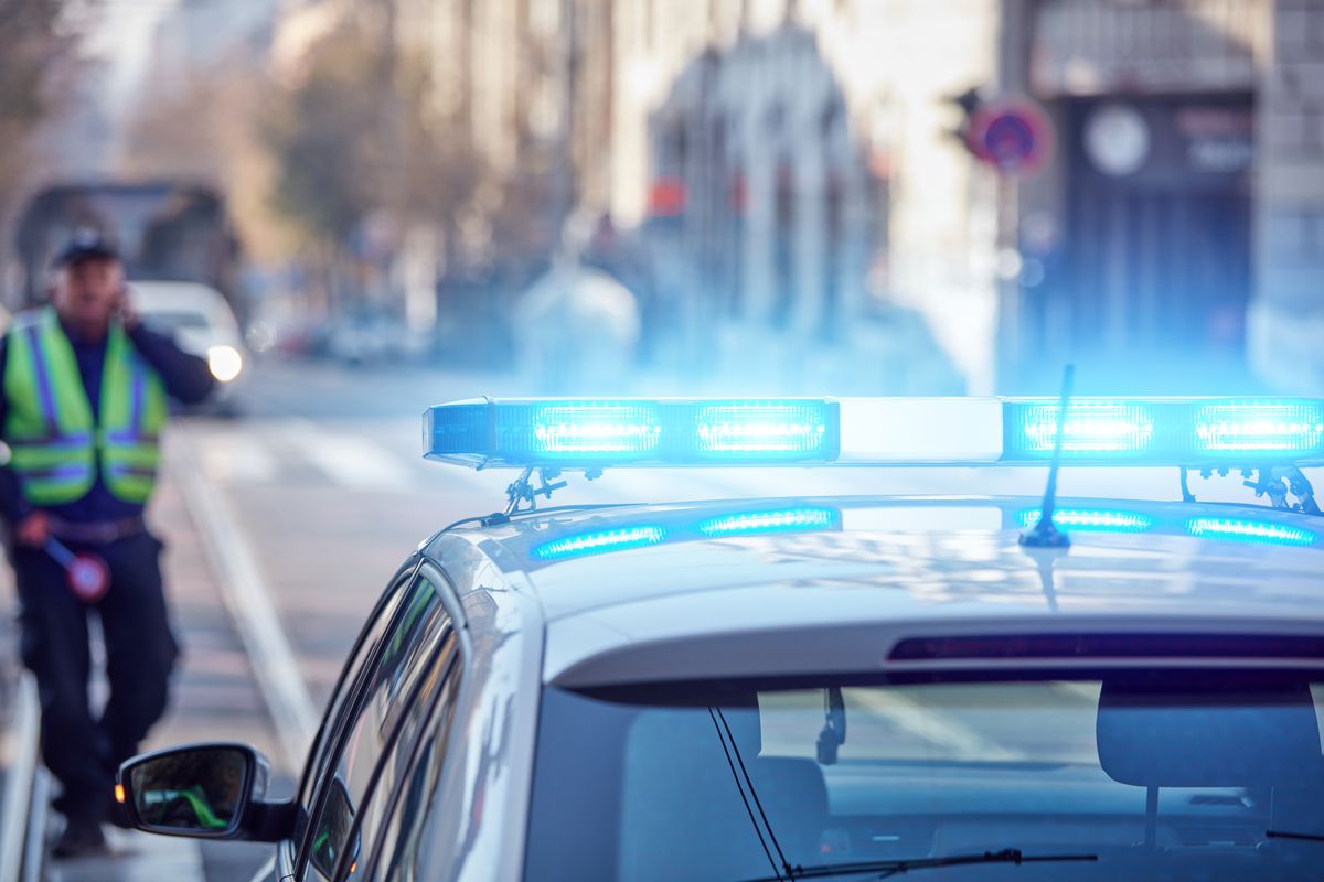 Police,Car,With,Blue,Lights,On,The,Crime,Scene,In