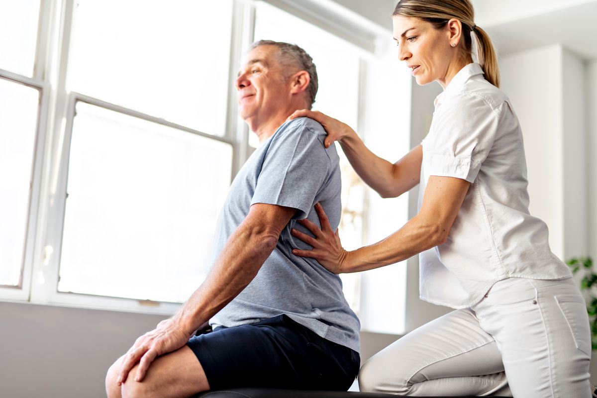 A,Modern,Rehabilitation,Physiotherapy,Worker,With,Senior,Client